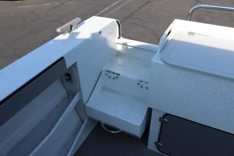 Slide: The Image of Interior view of 2026 KingFisher 2425 Escape HT boat, featuring storage compartments and seating. - 14