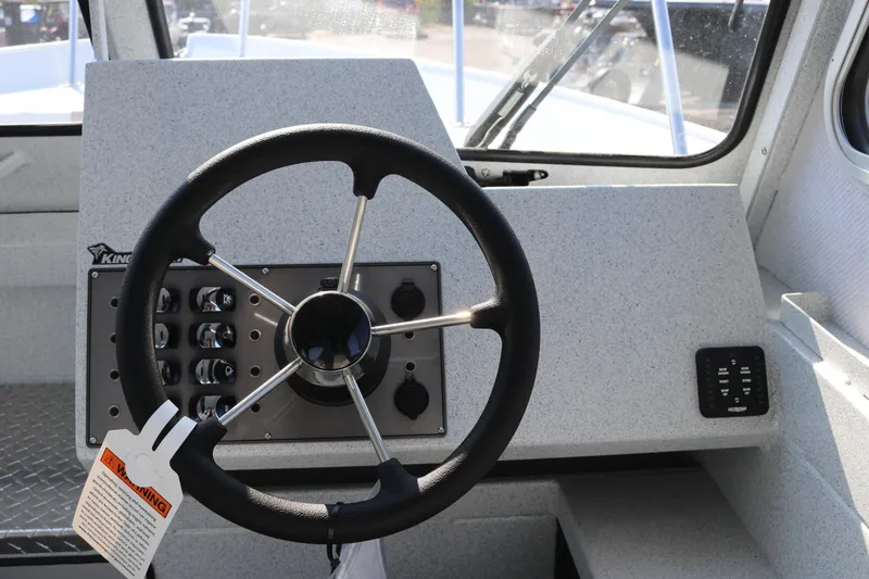 Slide: The Image of Steering wheel and dashboard of 2026 KingFisher 2425 Escape HT boat. - 18