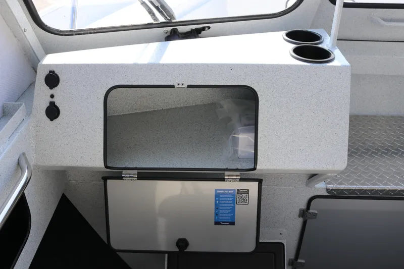 Slide: The Image of Interior of 2026 KingFisher 2425 Escape HT boat with storage and cup holders. - 21