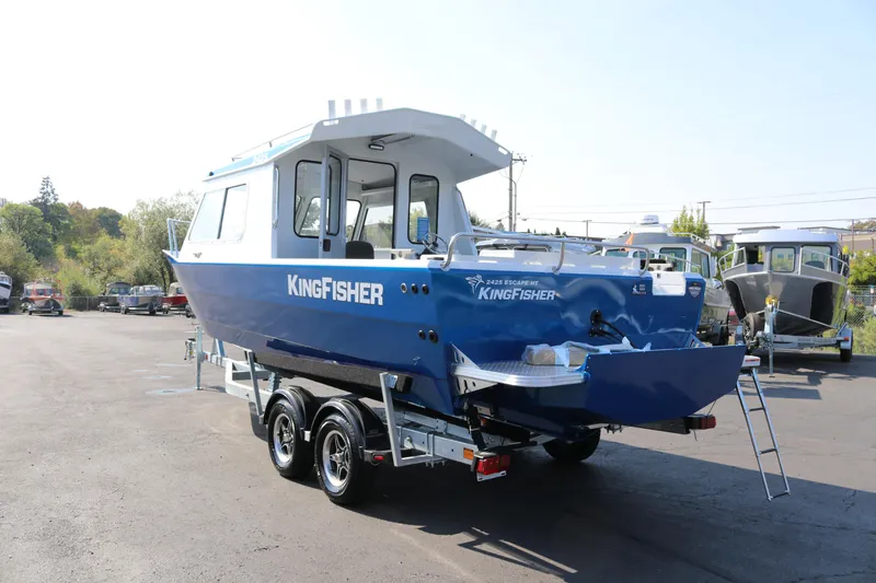 Slide: The Image of 2026 KingFisher 2425 Escape HT boat on trailer, parked outdoors. - 3