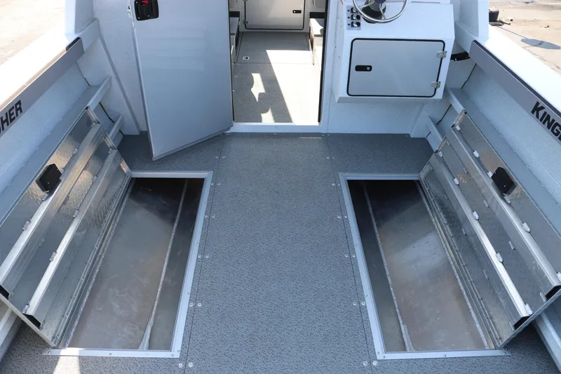 Slide: The Image of 2026 KingFisher 2425 Escape HT boat interior with open storage compartments. - 35