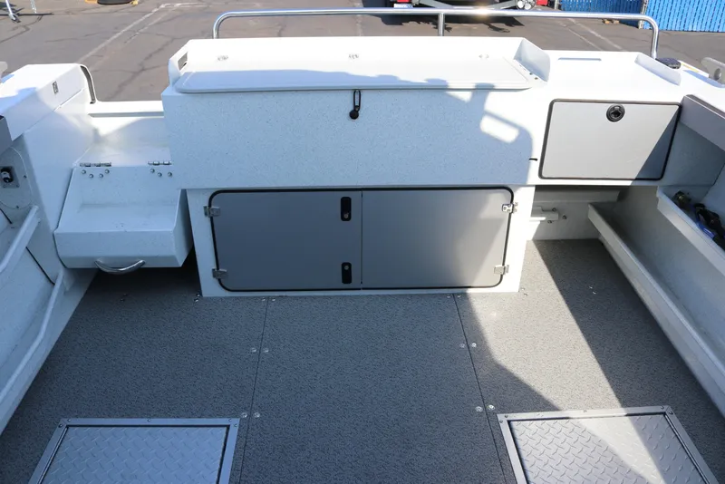Slide: The Image of Interior view of 2026 KingFisher 2425 Escape HT boat, showcasing storage compartments. - 6