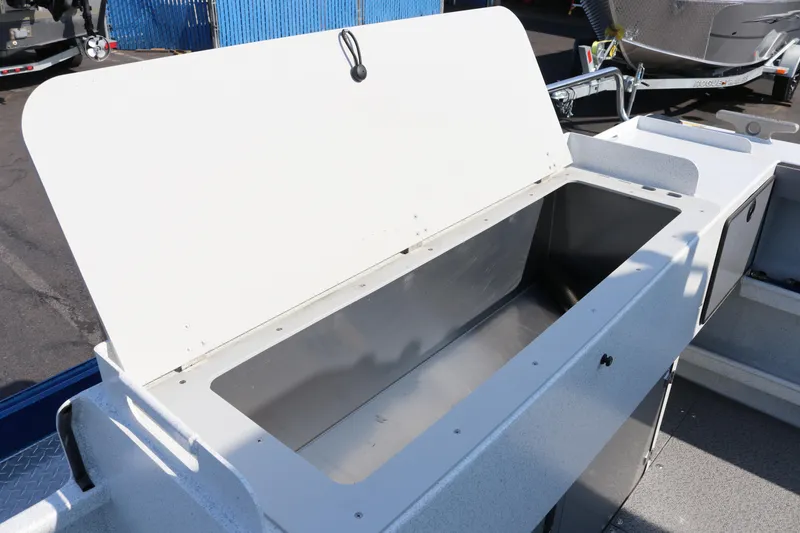 Slide: The Image of Open storage compartment on 2026 KingFisher 2425 Escape HT boat. - 7