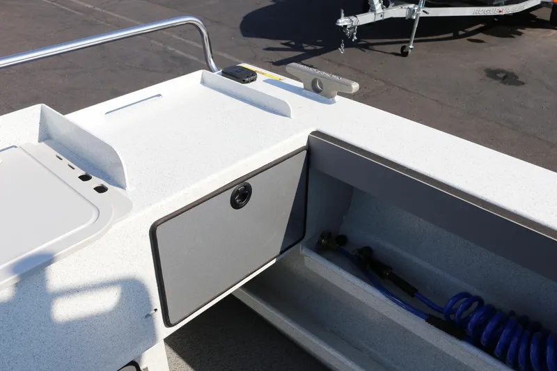 Slide: The Image of Interior view of 2026 KingFisher 2425 Escape HT boat, featuring storage compartments and equipment. - 8