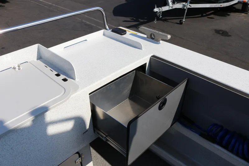 Slide: The Image of 2026 KingFisher 2425 Escape HT boat interior with open storage compartment. - 9