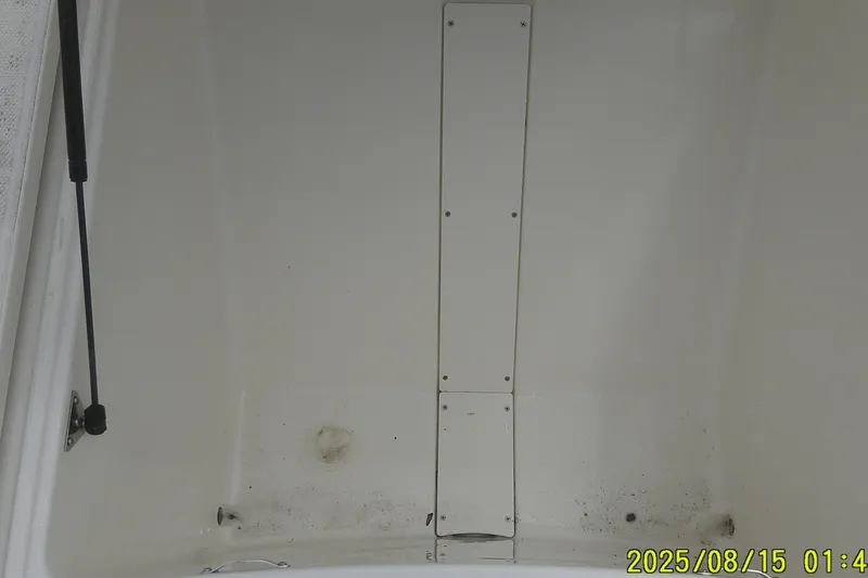 Slide: The Image of Interior view of a 2023 Mako Pro Skiff 19 CC boat hull, showing clean white surface. - 25