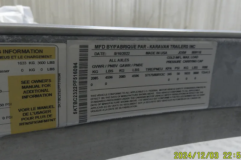 Slide: The Image of Label on a Karavan trailer showing manufacturing details and weight specifications. - 3