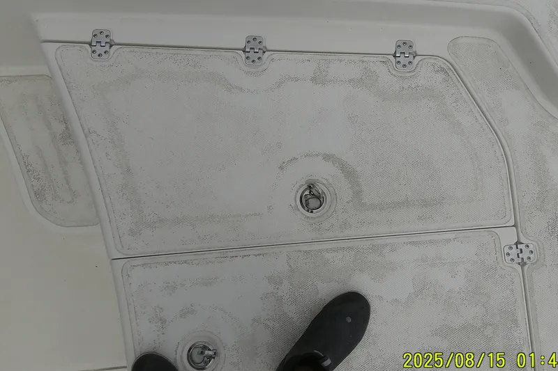 Slide: The Image of Deck of 2023 Mako Pro Skiff 19 CC boat with visible hatch and foot. - 30