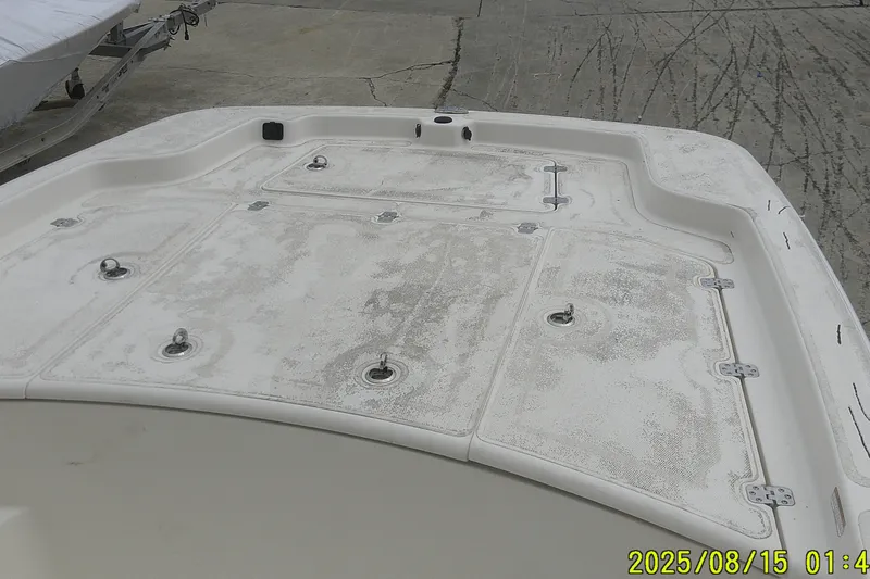 Slide: The Image of 2023 Mako Pro Skiff 19 CC boat deck with storage compartments. - 34