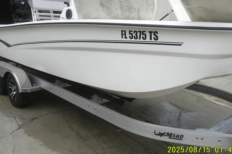 Slide: The Image of 2023 Mako Pro Skiff 19 CC boat on trailer, side view with registration number. - 37