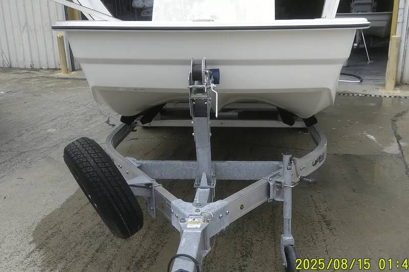 Slide: The Image of 2023 Mako Pro Skiff 19 CC on trailer, parked outdoors. - 38