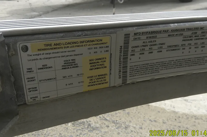 Slide: The Image of Tire and loading information label on a 2023 Mako Pro Skiff 19 CC trailer. - 42