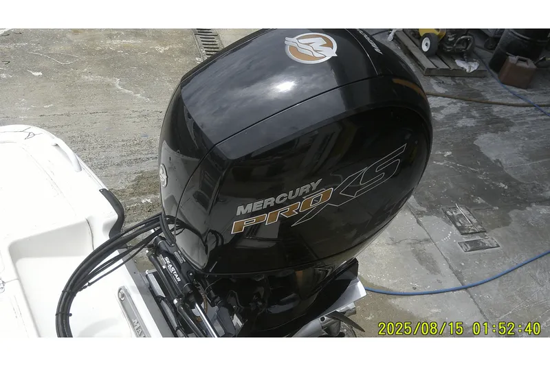 Slide: The Image of 2023 Mako Pro Skiff 19 CC with Mercury Pro XS outboard motor. - 6