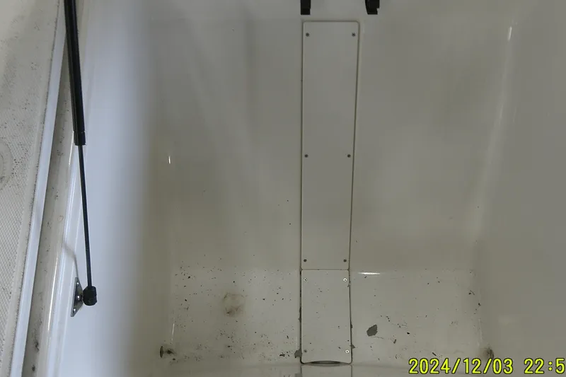 Slide: The Image of Interior view of a 2023 Mako Pro Skiff 19 CC boat compartment. - 60