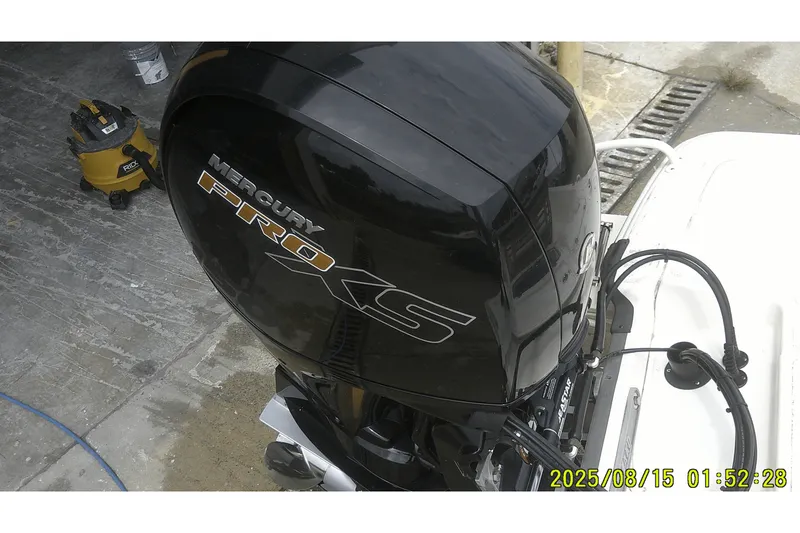 Slide: The Image of 2023 Mako Pro Skiff 19 CC with Mercury Pro XS outboard motor. - 7