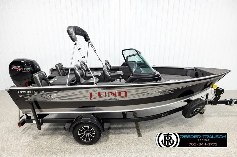 The Image of 2026 Lund 1875 Impact XS fishing boat with Mercury Pro XS engine on trailer. - 1