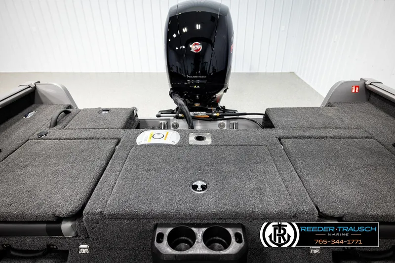 Slide: The Image of 2026 Lund 1875 Impact XS boat interior with motor and storage compartments. - 20