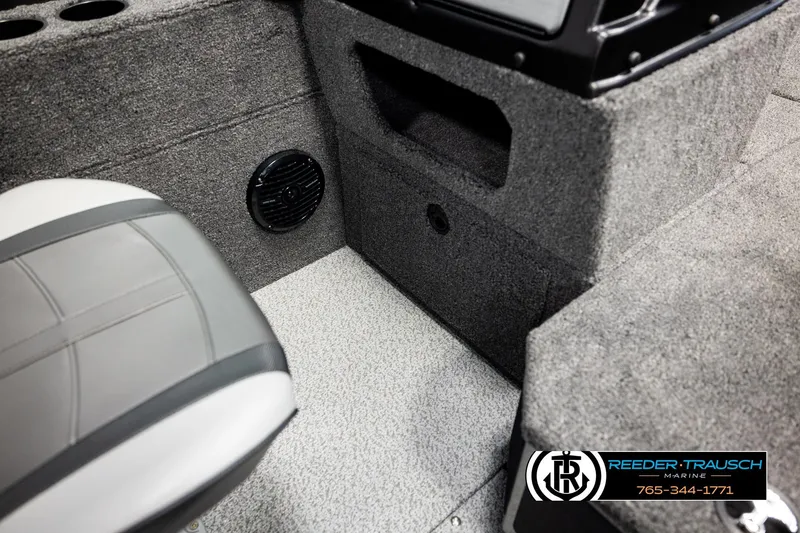 Slide: The Image of Interior of 2026 Lund 1875 Impact XS boat with seating and speaker detail. - 30