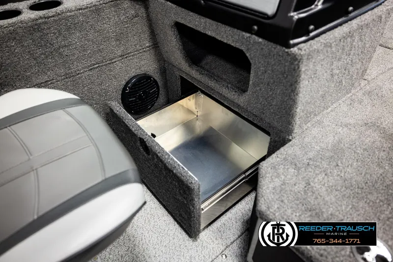 Slide: The Image of Interior of 2026 Lund 1875 Impact XS boat with open storage compartment. - 31