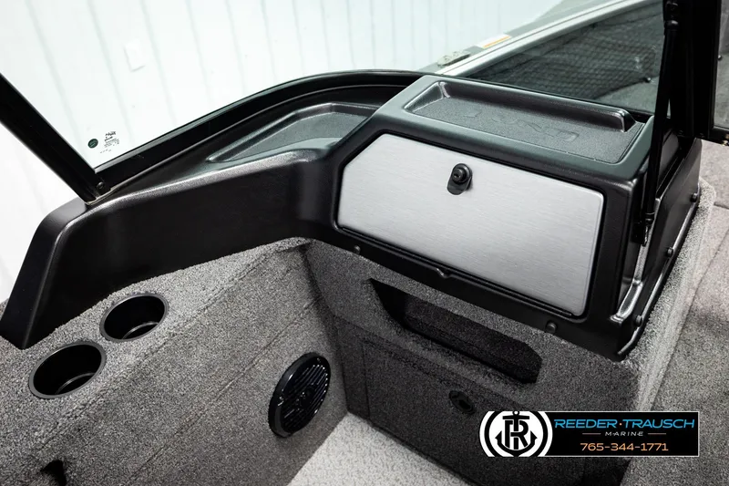 Slide: The Image of 2026 Lund 1875 Impact XS boat interior with storage compartment and cup holders. - 42