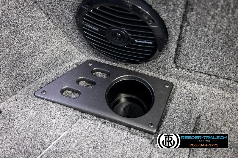 Slide: The Image of 2026 Lund 1875 Impact XS boat interior with speaker and cup holder. - 45