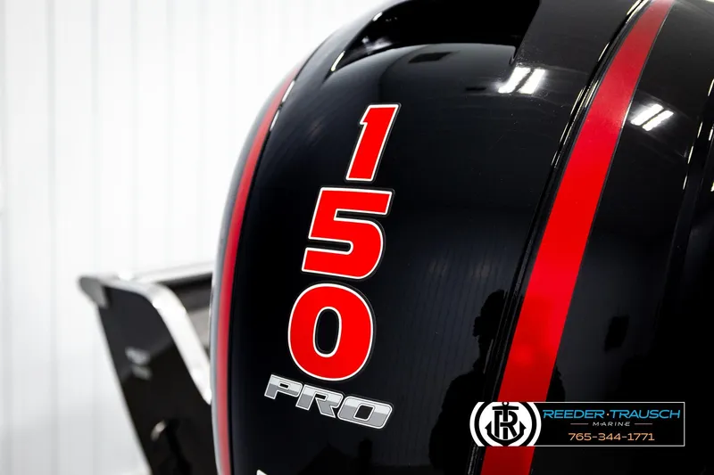 Slide: The Image of Close-up of a 2026 Lund 1875 Impact XS boat engine with "150 Pro" branding. - 49