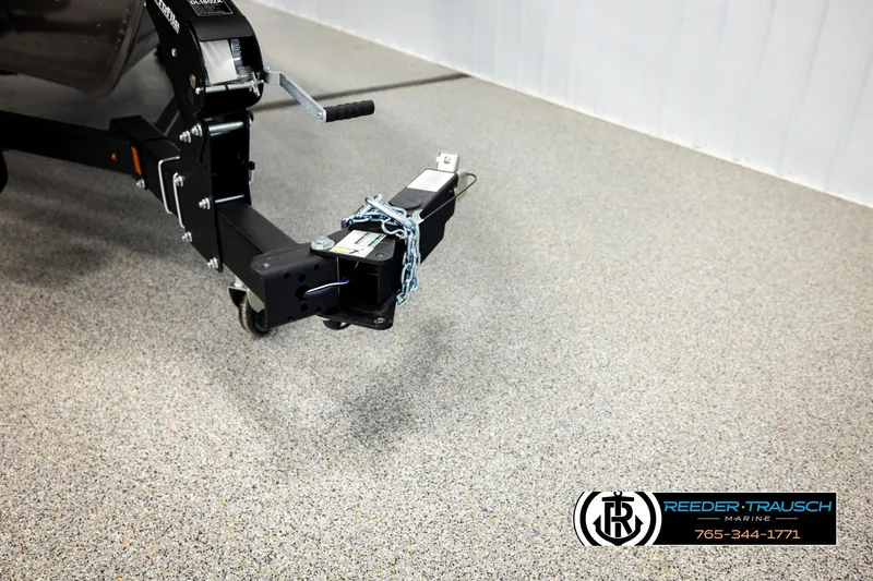 Slide: The Image of Trailer hitch of 2026 Lund 1875 Impact XS boat on showroom floor. - 51