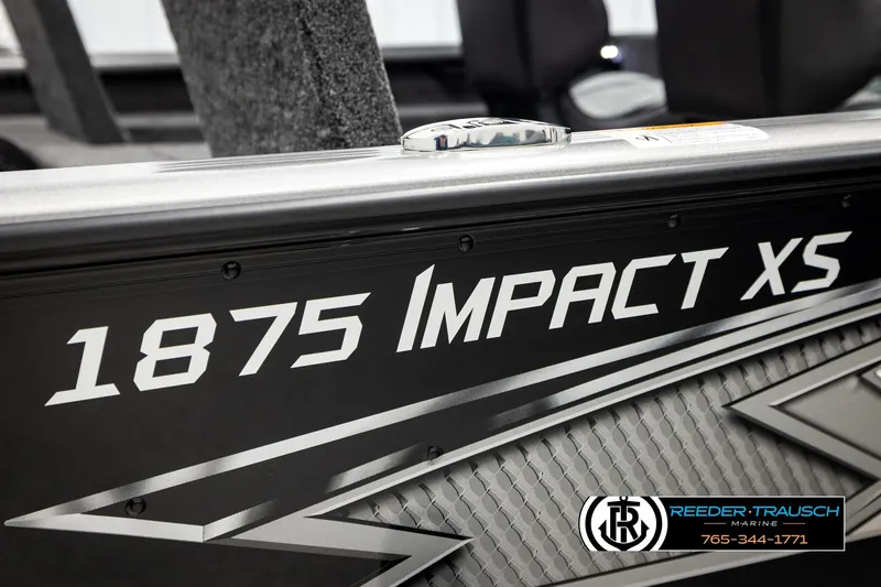 Slide: The Image of 2026 Lund 1875 Impact XS boat detail with Reeder-Trausch Marine branding. - 56
