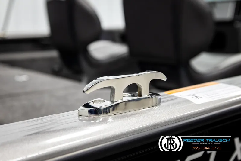 Slide: The Image of 2026 Lund 1875 Impact XS boat cleat detail with Reeder-Trausch Marine branding. - 58