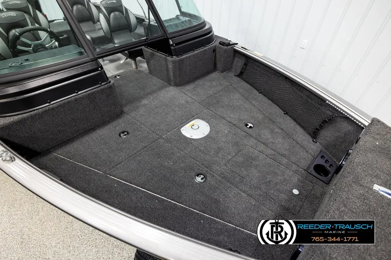 Slide: The Image of 2026 Lund 1875 Impact XS boat interior with spacious deck and seating. - 8