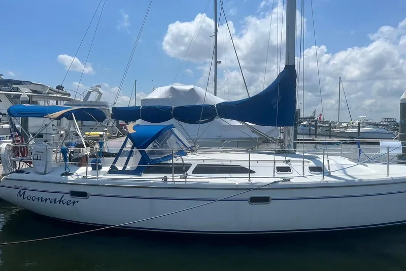 The Image of 1995 Catalina 36 MkII sailboat docked at marina under blue sky. - 0