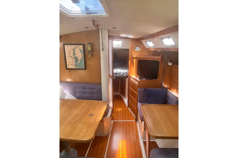 Slide: The Image of Interior of a 1995 Catalina 36 MkII sailboat with wood finish and seating area. - 12