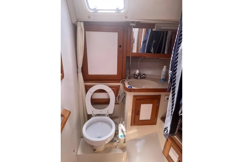 Slide: The Image of Bathroom interior of 1995 Catalina 36 MkII sailboat with toilet and sink. - 16