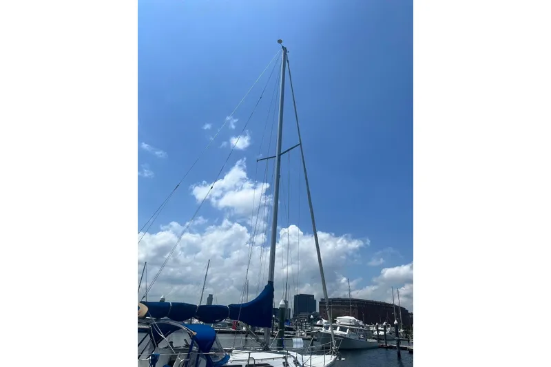 Slide: The Image of Sailboat Catalina 36 MkII 1995 docked under a clear blue sky. - 6