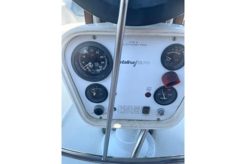 Slide: The Image of Control panel of a 1995 Catalina 36 MkII yacht with gauges and indicators. - 9