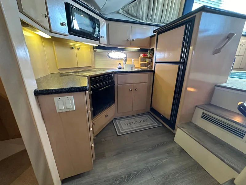 Slide: The Image of Compact kitchen area in a 2000 Carver 406 Motor Yacht with modern appliances. - 20