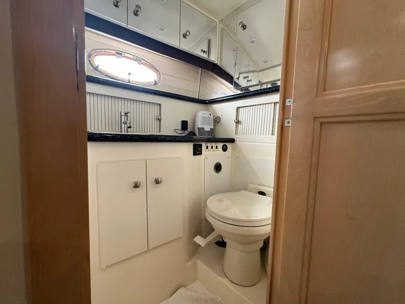 Slide: The Image of Bathroom interior of a 2000 Carver 406 Motor Yacht with modern fixtures. - 27