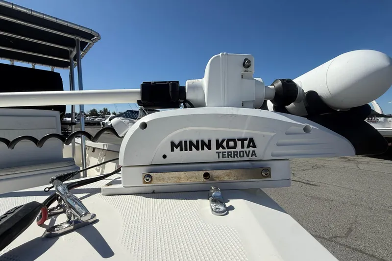 Slide: The Image of Minn Kota Terrova motor on 2012 May-Craft 190CC boat under clear blue sky. - 4