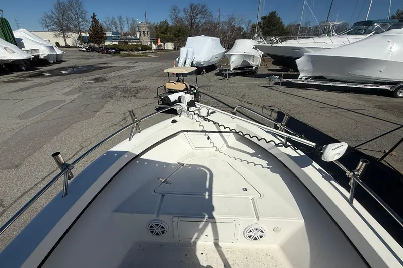Slide: The Image of 2012 May-Craft 190CC boat on display in a marina with other vessels. - 5