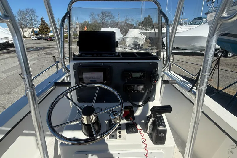 Slide: The Image of 2012 May-Craft 190CC boat console with steering wheel and navigation equipment. - 7