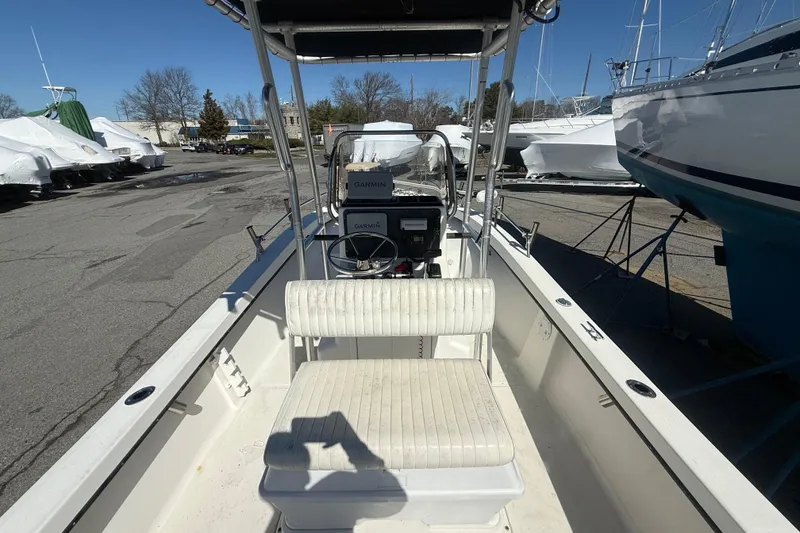 Slide: The Image of 2012 May-Craft 190CC boat interior with Garmin equipment, docked in a marina. - 9