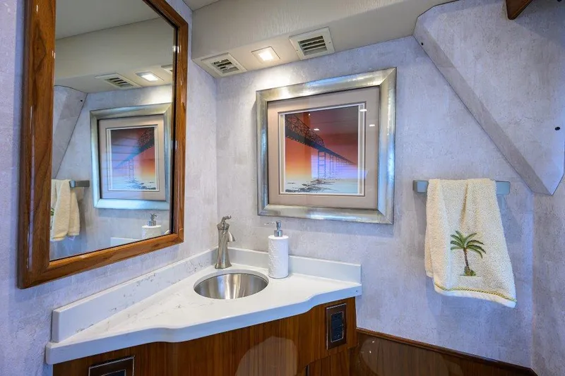 Slide: The Image of Luxurious bathroom in 2020 Viking 72 Convertible yacht with modern fixtures and elegant decor. - 11