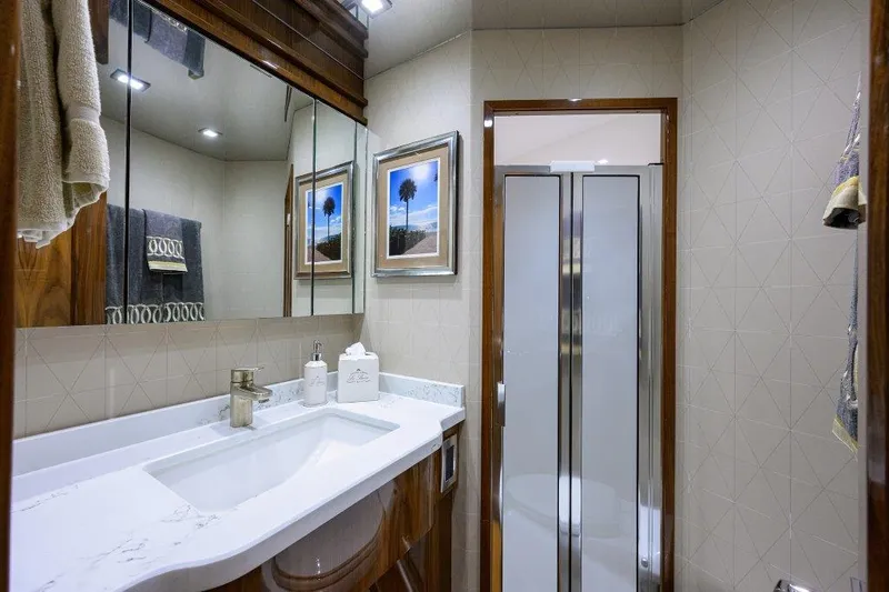 Slide: The Image of Luxurious bathroom in 2020 Viking 72 Convertible yacht with modern fixtures and elegant decor. - 17