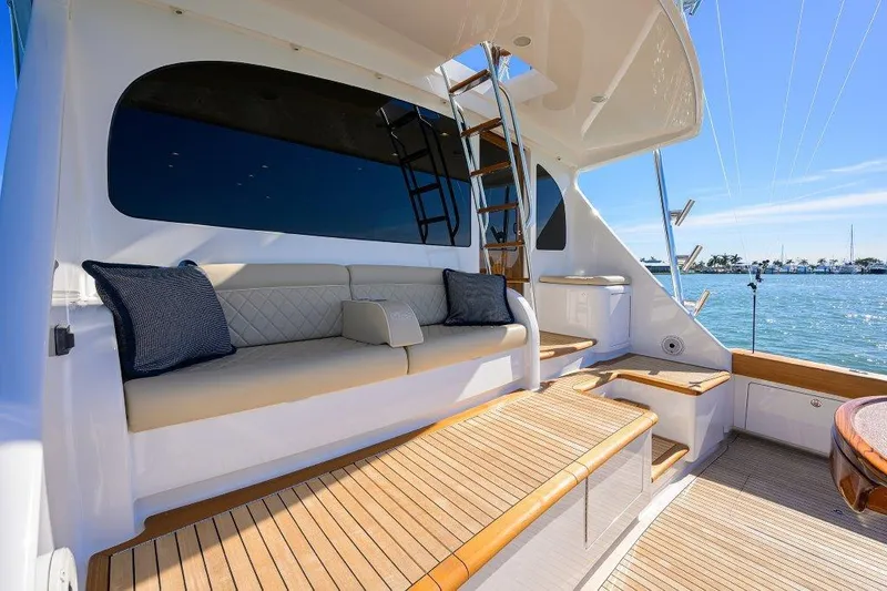 Slide: The Image of Luxurious seating area on a 2020 Viking 72 Convertible yacht with ocean view. - 25