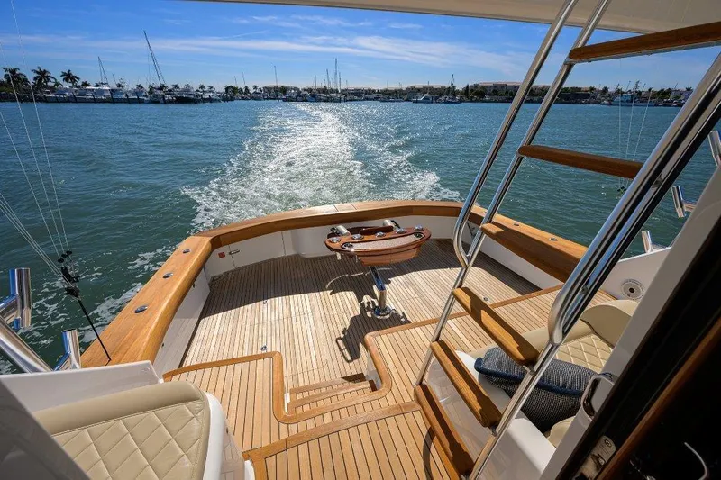 Slide: The Image of Viking 72 Convertible 2020 yacht deck with ocean view and seating area. - 28