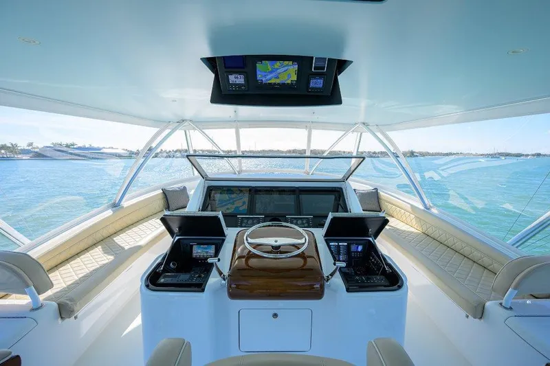Slide: The Image of Luxurious helm of 2020 Viking 72 Convertible yacht with advanced navigation systems. - 31