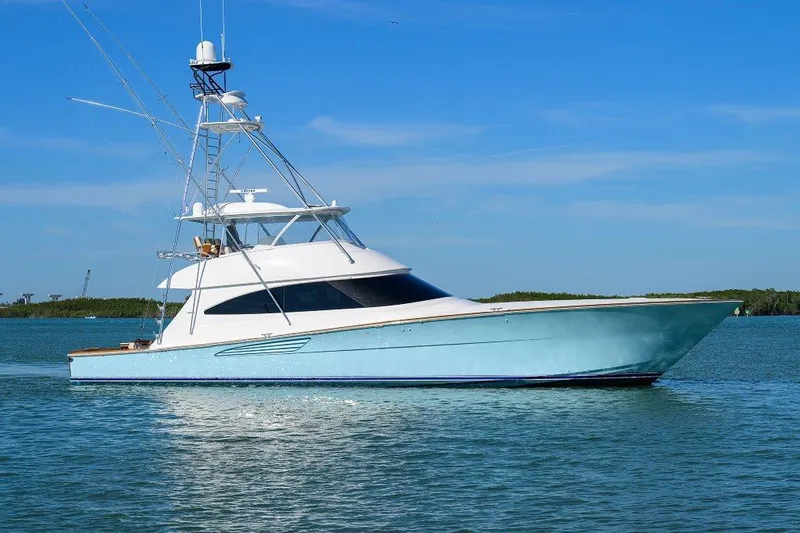 Slide: The Image of 2020 Viking 72 Convertible yacht on calm blue waters. - 41