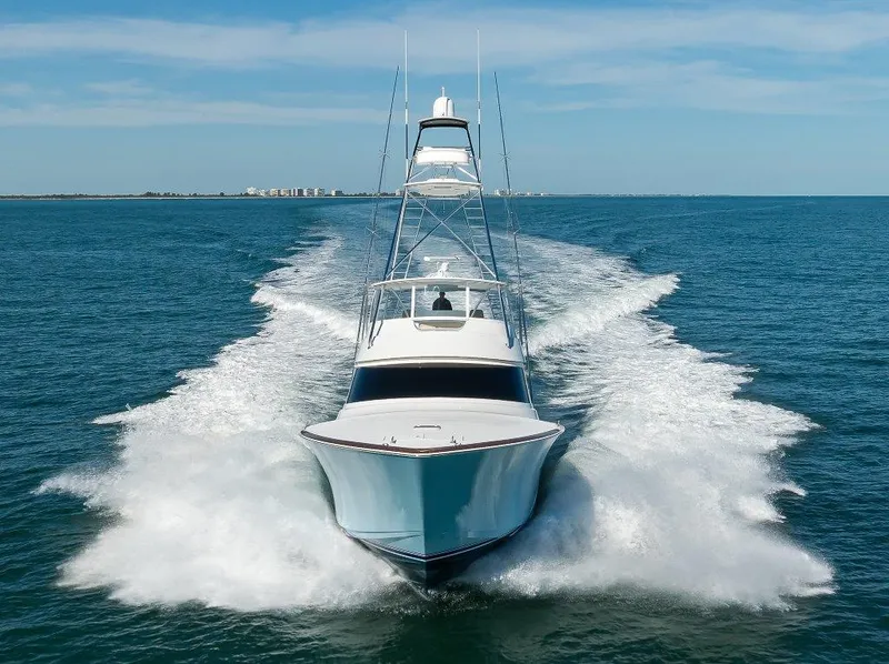 Slide: The Image of 2020 Viking 72 Convertible yacht cruising on open water. - 42