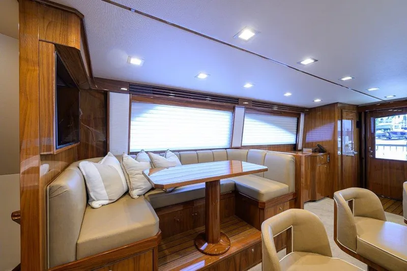 Slide: The Image of Luxurious interior of 2020 Viking 72 Convertible yacht with elegant seating and wooden finishes. - 5