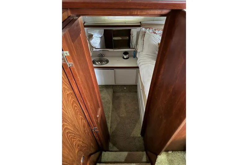 Slide: The Image of Interior view of 1993 Carver 300 Aft Cabin with sink and bed. - 31